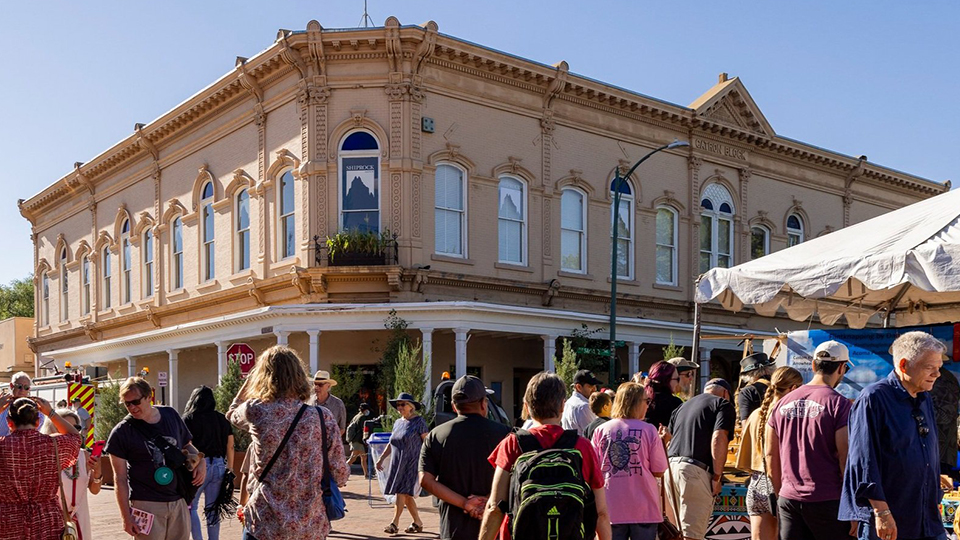 a crowd of people browse the Santa Fe Native American Art Market