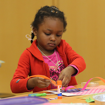 two young children working on an art project in the Nerman classroom