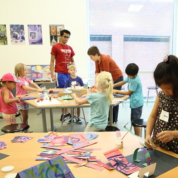 A group of children create art during a youth art class at the Nerman Museum