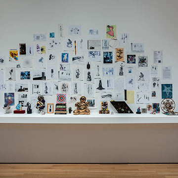 A collage of images and objects by Shinique Smith on display at the Nerman Museum