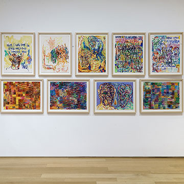 a grouping of 9 drawings by basil Kincaid on display at the Nerman Museum