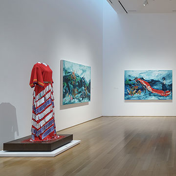 4 paintings and a dress created by Julie Buffalohead on display at the Nerman