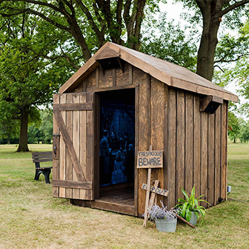 a wooden shed with a sign saying trespassers beware and keep out