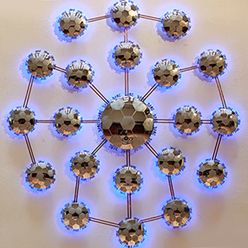 a grouping of backlit mirrors in a similar pattern to a soccer ball